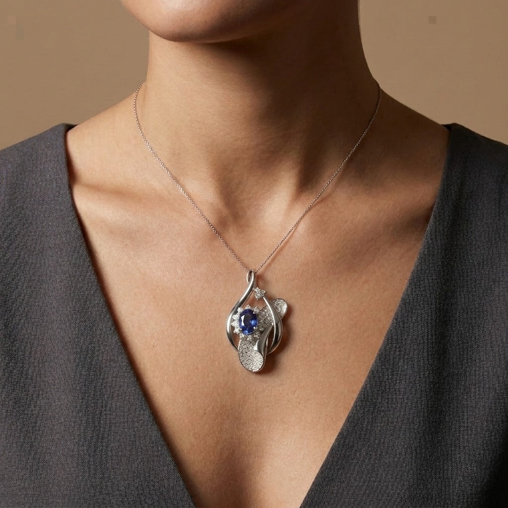 Platinum 1.14ct Oval Blue Sapphire 0.50cttw White Diamonds Pendant