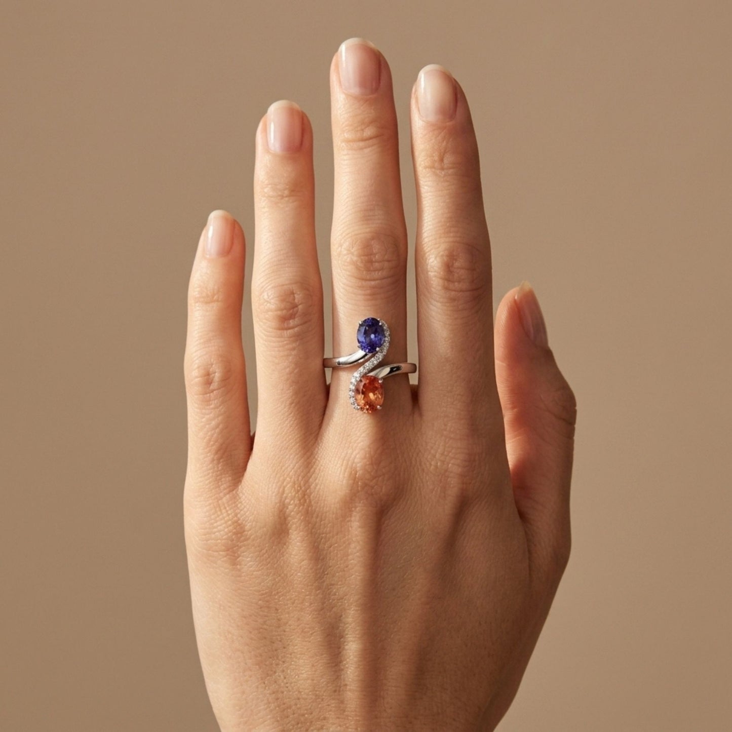 18K 1.50ct Oval Rhodochrosite 1.15ct Oval Tanzanite 0.17cttw White Diamonds Ring