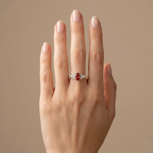 Platinum 0.95ct Oval Padparadscha 0.36cttw White Diamonds Ring