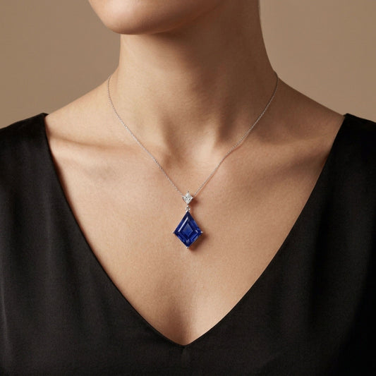 14K 12.72ct Fancy Cut Blue Wing Tanzanite 0.56ct Kite Cut VS White Diamond Pendant