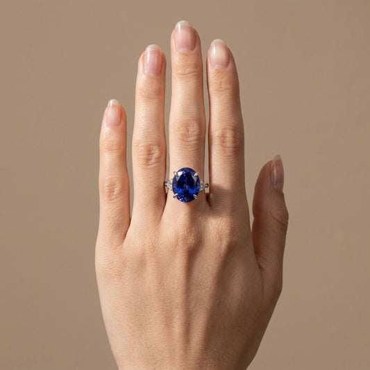 14K 12.92ct Oval Blue Wing Tanzanite 0.29cttw Fancy Cut VS White Diamond Ring