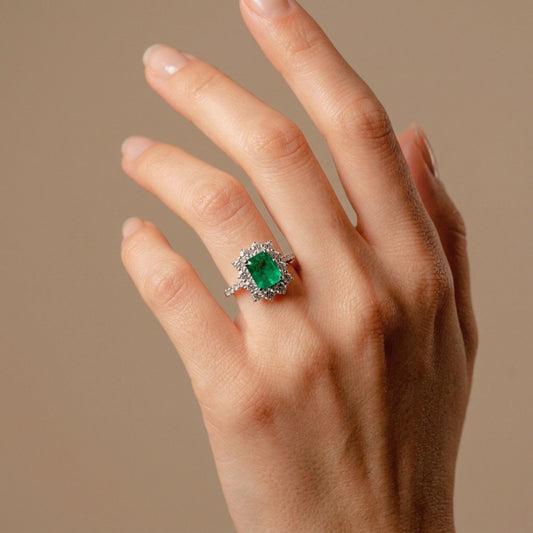 Platinum 1.25ct Emerald Cut Colombian Emerald 0.7cttw White Diamonds Ring