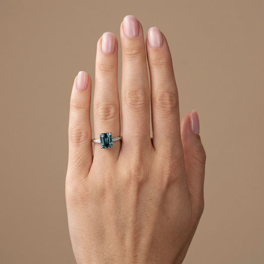 18K 2.66ct Emerald Cut Blue Zircon 0.11cttw Tapered Baguette White Diamond Ring
