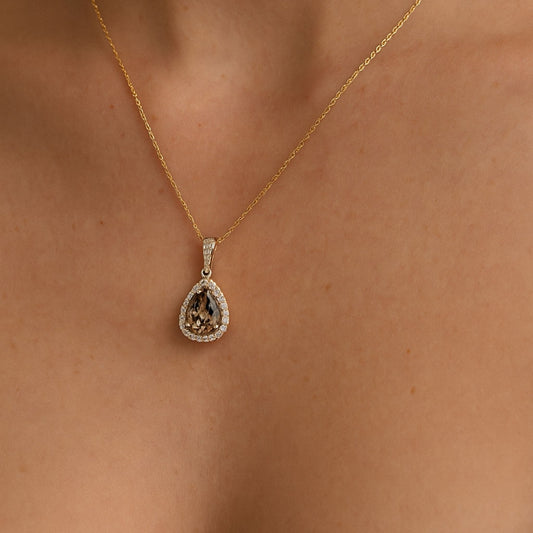 14K 4.70ct Pear Shape Color Change Diaspore 0.58cttw VS White Diamonds Pendant