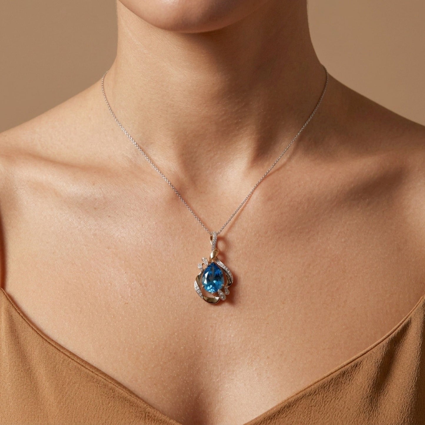 14K 4.33ct Leaf Cut Swiss Blue Topaz 0.18cttw VS White Diamonds Pendant