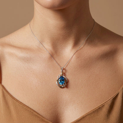 14K 4.33ct Leaf Cut Swiss Blue Topaz 0.18cttw VS White Diamonds Pendant