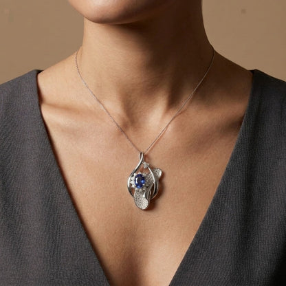 Platinum 1.14ct Oval Blue Sapphire 0.50cttw White Diamonds Pendant