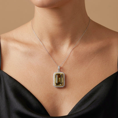 14K 12.05ct Emerald Cut Unheated Tanzanite 1.10cttw Yellow & White Diamonds Pendant