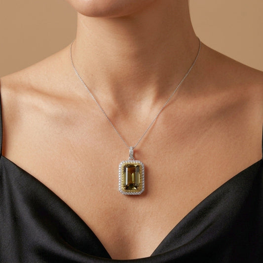 14K 12.05ct Emerald Cut Unheated Tanzanite 1.10cttw Yellow & White Diamonds Pendant
