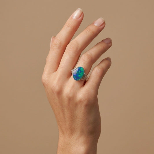 Platinum 4.29ct Oval Black Opal 0.35cttw White Diamonds Ring