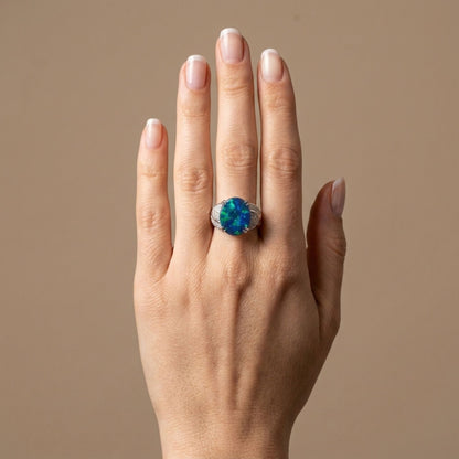Platinum 5.11ct Oval Black Opal 0.90cttw White Diamonds Ring