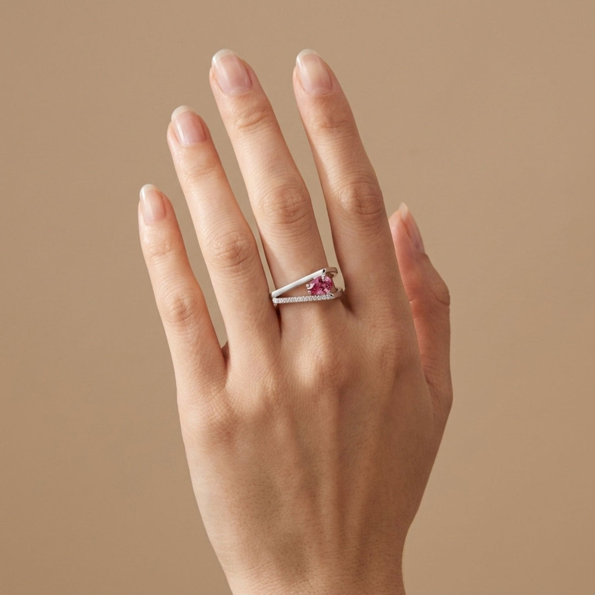 14K gold ring with pear shape Mahenge pink spinel and VS white diamonds