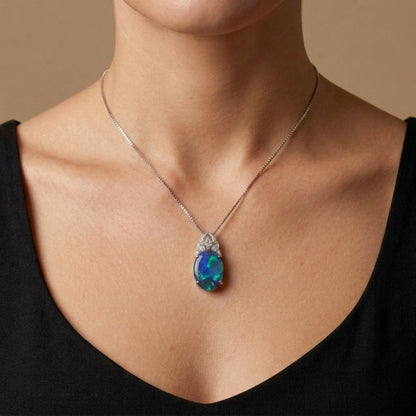 Platinum 5.64ct Oval Black Opal 0.24cttw White Diamonds Necklace