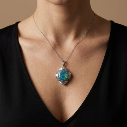 Platinum 9.03ct oval black opal pendant with 2.20cttw white diamonds