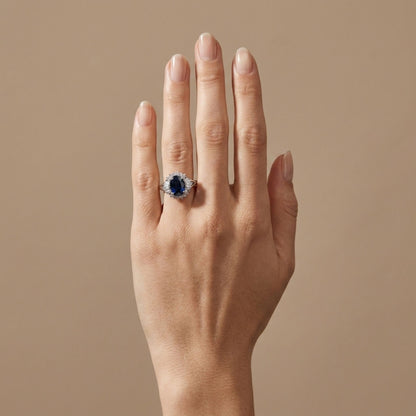 Platinum 2.43ct Oval Blue Sapphire 0.45cttw White Diamonds Ring