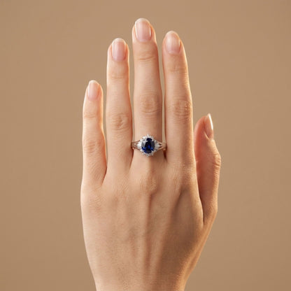 Platinum 1.68ct Oval Blue Sapphire 0.22cttw White Diamonds Ring