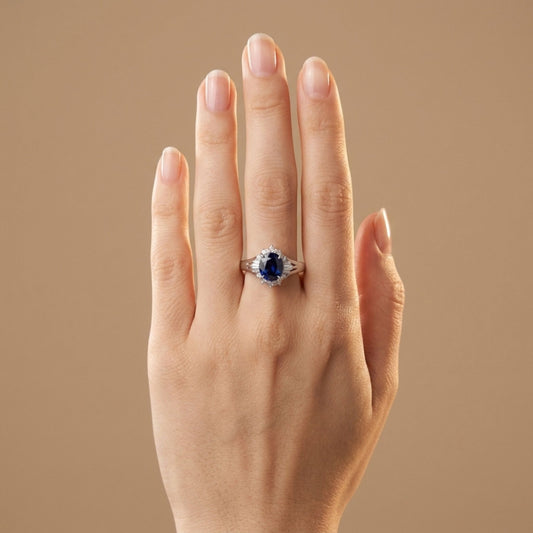 Platinum 1.68ct Oval Blue Sapphire 0.22cttw White Diamonds Ring