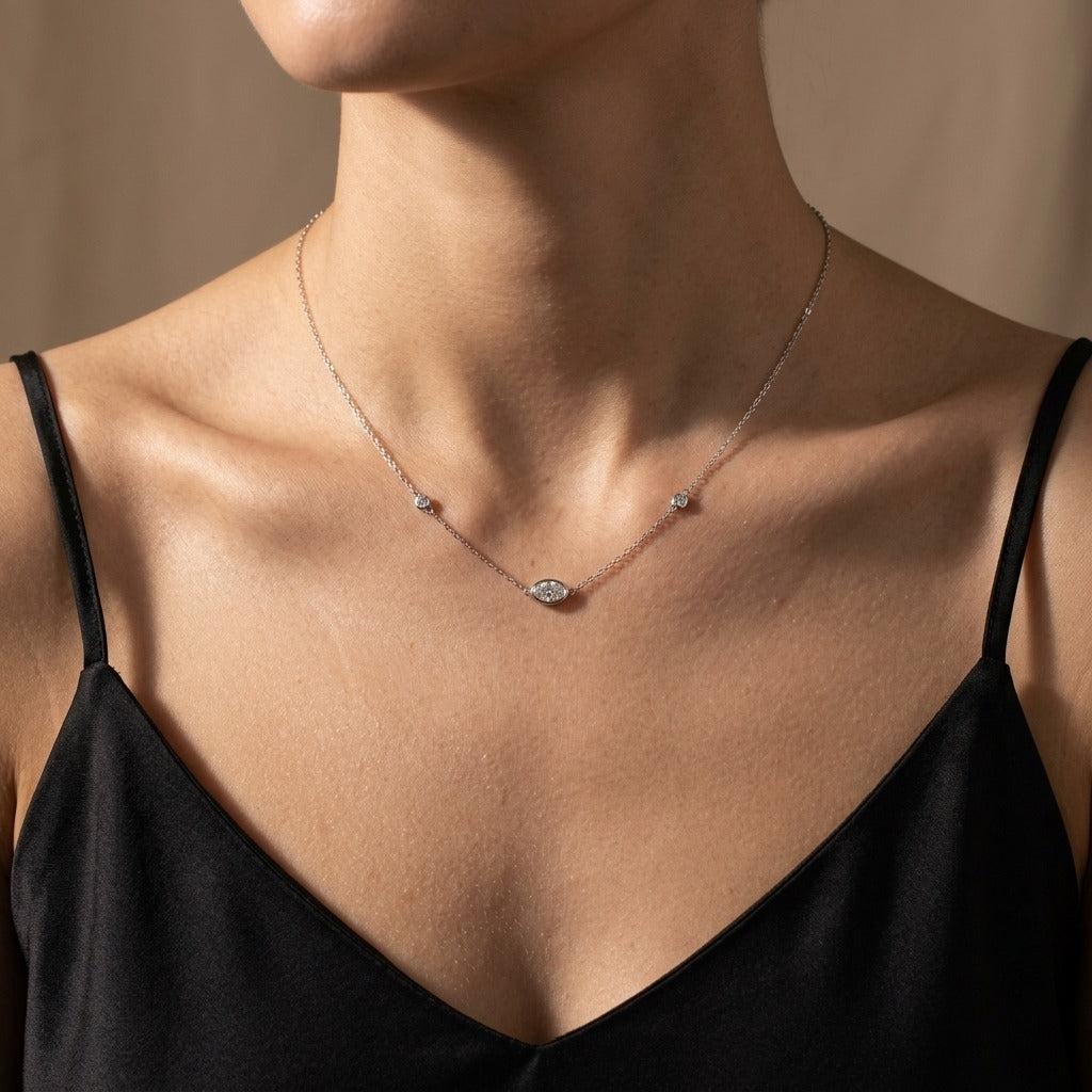 14K gold 0.40cttw oval VS white diamond bezel set solitaire necklace
