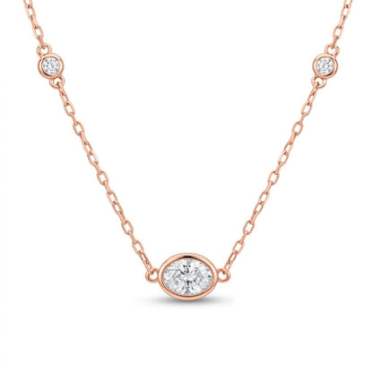 14K gold bezel set solitaire necklace with 0.40cttw oval VS white diamond