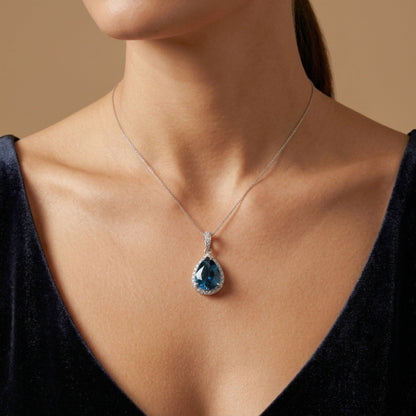 14K 11.43ct Pear Shape Blue Zircon 0.59cttw VS White Diamonds Pendant