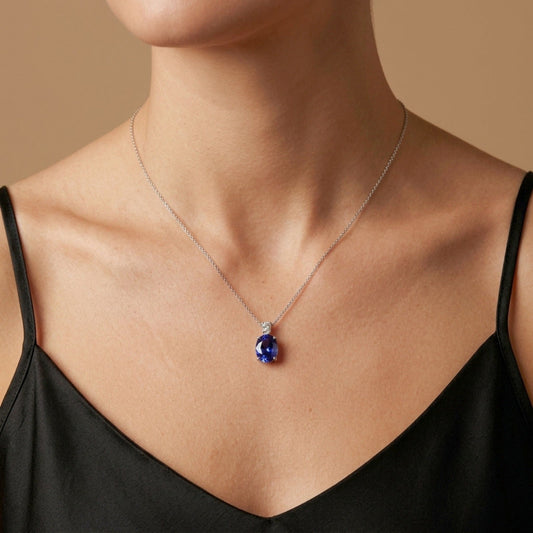 14K 2.00ct Oval Blue Wing Tanzanite 0.15ct VS White Diamond Pendant