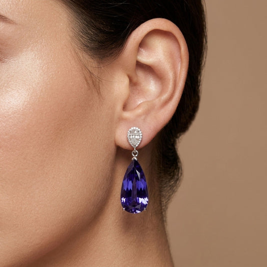 14K 24.15cttw Pear Shape Blue Wing Tanzanite 0.99cttw White Diamonds Earrings