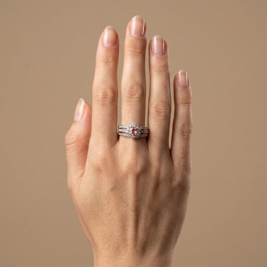 Platinum 0.52ct Oval Padparadscha 0.54cttw White Diamonds Ring
