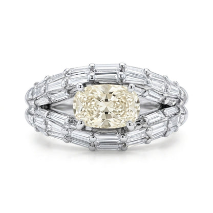 Platinum 1.01ct Oval Yellow Diamond 1.28cttw Baguette White Diamond Ring