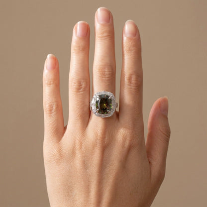 18K 7.13ct Oval Color Change Sphene 1.28cttw White Diamonds Ring