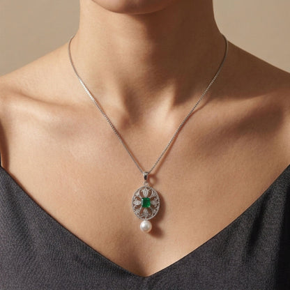 18K 0.34ct Emerald Cut Colombian Emerald 6.1mm Freshwater White Pearl 0.10cttw White Diamonds Necklace