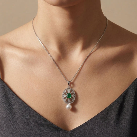 18K 0.34ct Emerald Cut Colombian Emerald 6.1mm Freshwater White Pearl 0.10cttw White Diamonds Necklace