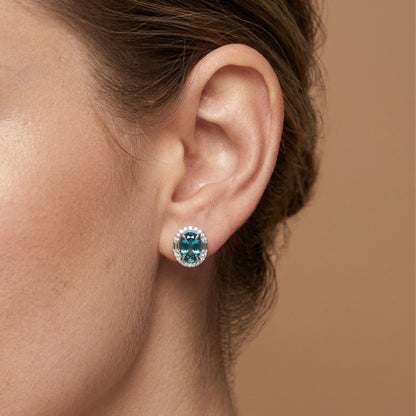 18K 6.24cttw Oval Blue Zircon 0.53cttw White Diamonds Stud Earrings