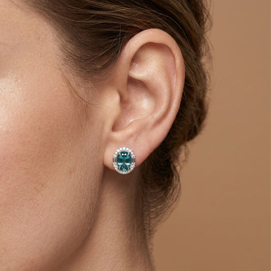 18K 6.24cttw Oval Blue Zircon 0.53cttw White Diamonds Stud Earrings
