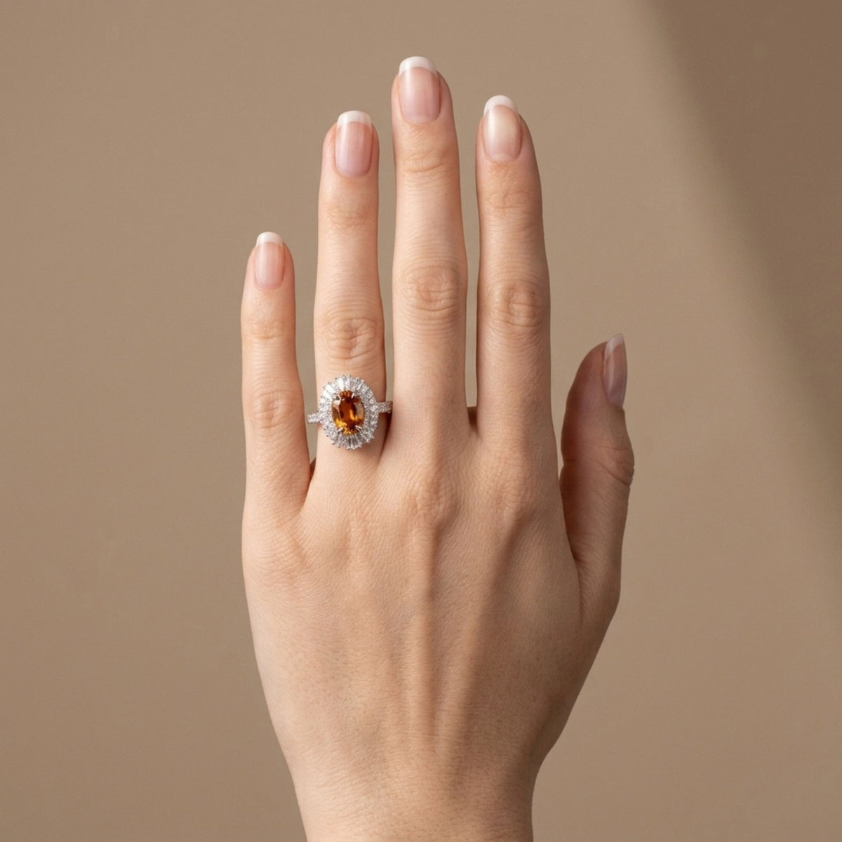18K gold oval mandarin garnet ring with VS white diamonds