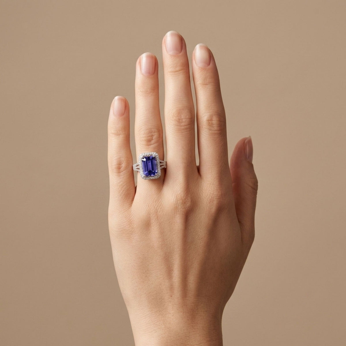 14K gold emerald cut Blue Wing Tanzanite ring with VS white diamonds