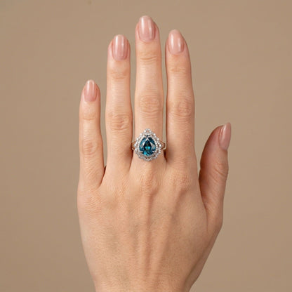14K 4.06ct Pear Shape Blue Zircon 0.50cttw VS White Diamonds Ring