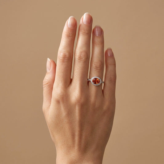 Platinum 1.81ct Oval Mandarin Garnet 0.23cttw White Diamonds Ring