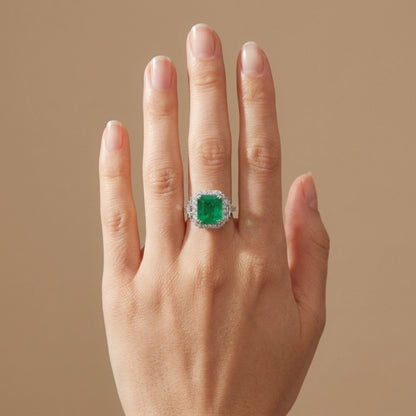18K 4.17ct Emerald Cut Zambian Emerald 1.01cttw VS White Diamonds Ring