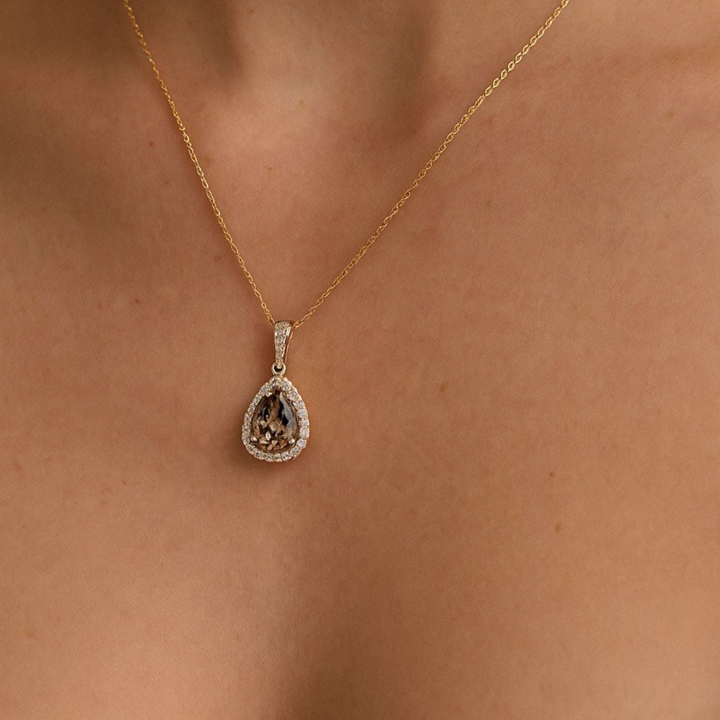 14K 4.70ct Pear Shape Color Change Diaspore 0.58cttw VS White Diamonds Pendant