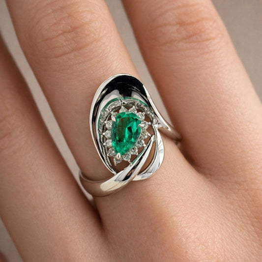 Platinum 1.21ct Pear Shape Colombian Emerald 0.31cttw White Diamonds Ring
